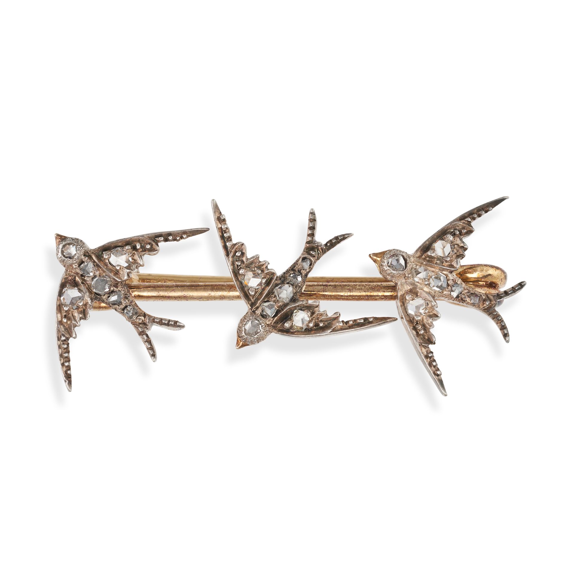 AN ANTIQUE DIAMOND SWALLOW BROOCH in yellow gold and silver, comprising three swallows set with r...