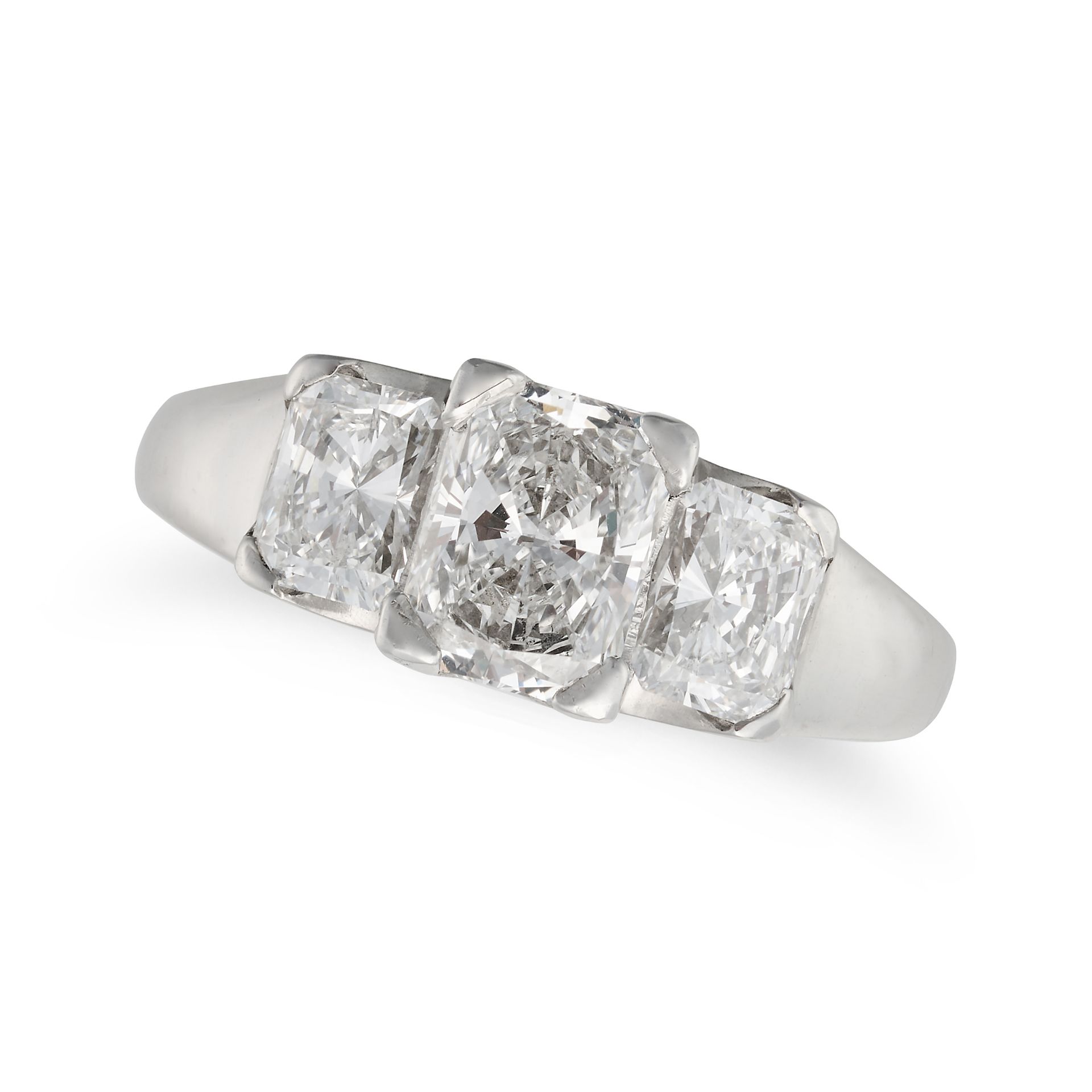 A DIAMOND THREE STONE RING in platinum, set with three radiant cut diamonds all totalling approxi...