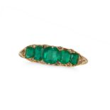 AN ANTIQUE EMERALD AND DIAMOND RING in 18ct yellow gold, set with a row of five cushion cut emera...