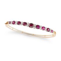 A RUBY AND DIAMOND BANGLE the hinged bangle set with a row of cushion cut rubies accented by old ...