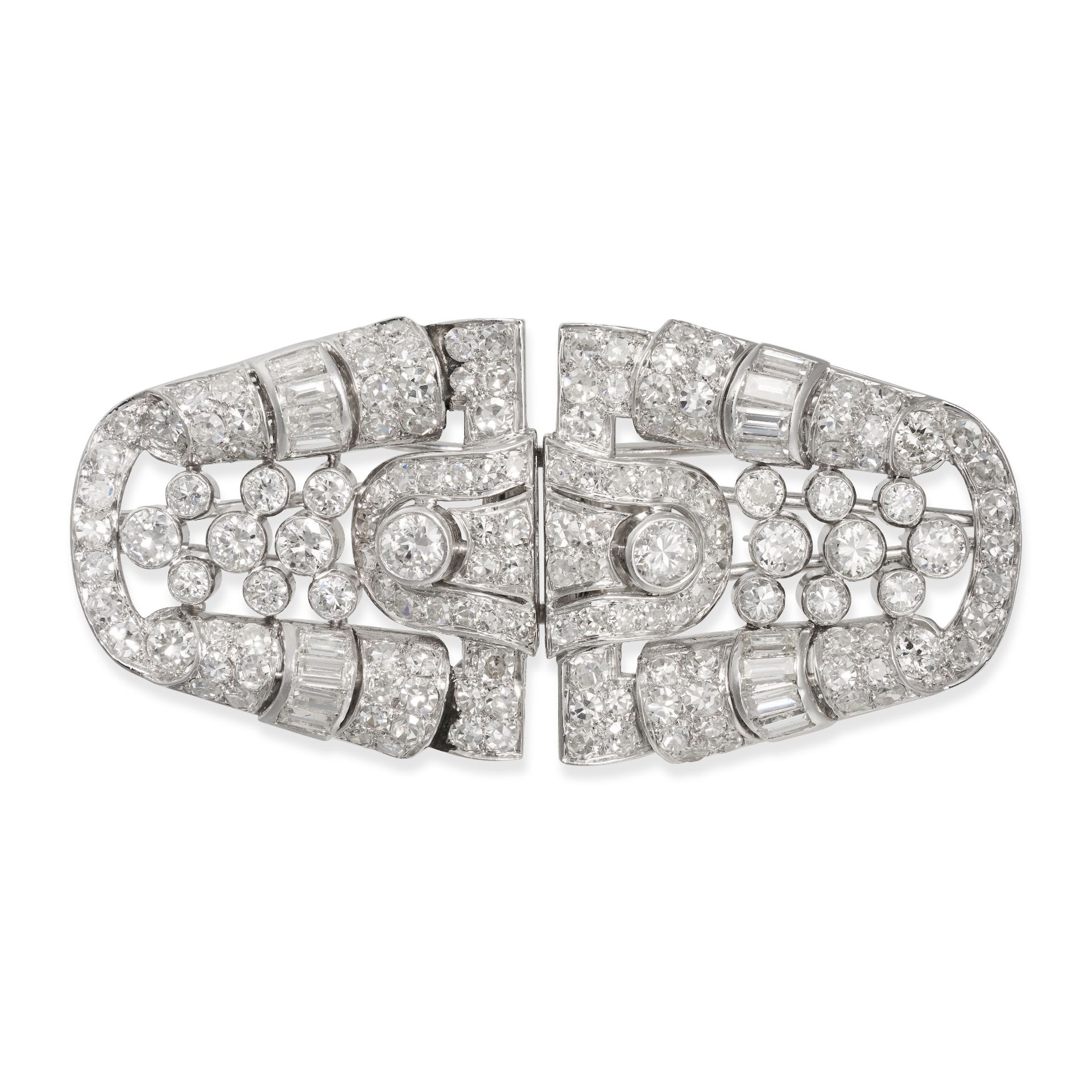 A DIAMOND DOUBLE CLIP BROOCH in white gold and platinum, the openwork brooch set throughout with ...