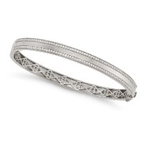 A DIAMOND BANGLE in 18ct white gold, the hinged bangle set with two rows of round cut diamonds, f...