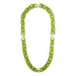 A PERIDOT AND PEARL CHAIN NECKLACE designed as a series of belcher style links formed of faceted ...