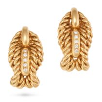 A PAIR OF DIAMOND CLIP EARRINGS each in woven design accented by a row of round brilliant cut dia...