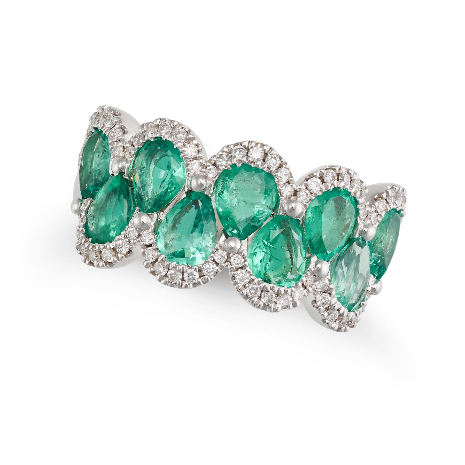 AN EMERALD AND DIAMOND DRESS RING in 18ct white gold, set with a row of pear cut emeralds accente...