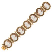 AN ANTIQUE SHELL CAMEO AND ENAMEL BRACELET in yellow gold, set with seven shell cameos carved to ...