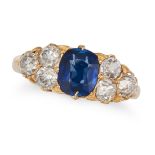 AN ANTIQUE SAPPHIRE AND DIAMOND RING in 18ct yellow gold, set with a cushion cut sapphire of appr...