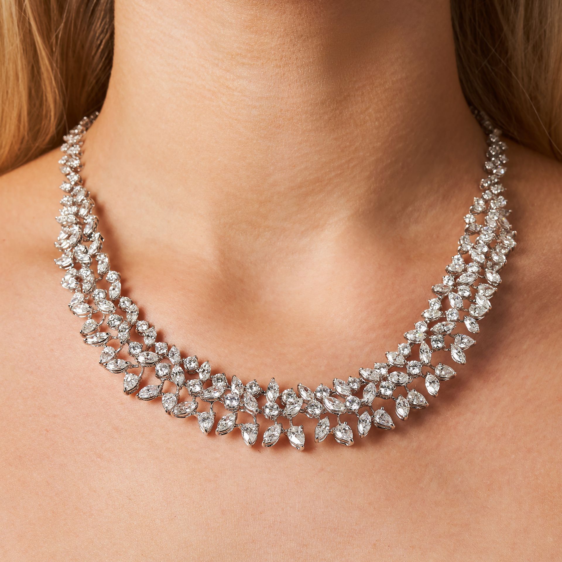A 30.58 CARAT DIAMOND NECKLACE set throughout with marquise, pear and round brilliant cut diamond...