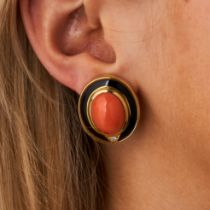 BULGARI, A PAIR OF CORAL, DIAMOND AND ENAMEL CLIP EARRINGS each set with an oval cabochon coral a...