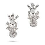 A PAIR OF DIAMOND FLOWER BROOCHES each designed as a stylised flower, set with an old cut diamond...