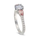 A BLUE AND FANCY ORANGY PINK DIAMOND RING set with a round brilliant cut blue diamond of approxim...