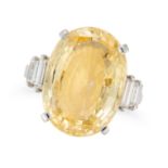 A YELLOW SAPPHIRE AND DIAMOND RING set with an oval cut yellow sapphire of approximately 10.82 ca...
