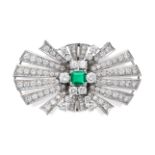 AN EMERALD AND DIAMOND BROOCH set to the centre with an octagonal step cut emerald accented by ro...
