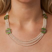 AN ART NOUVEAU NATURAL PEARL, DIAMOND AND ENAMEL NECKLACE in yellow gold, comprising four rows of...