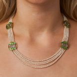 AN ART NOUVEAU NATURAL PEARL, DIAMOND AND ENAMEL NECKLACE in yellow gold, comprising four rows of...