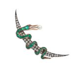 AN ANTIQUE EMERALD, DIAMOND, PEARL AND RUBY CRESCENT MOON AND SNAKE BROOCH in yellow gold and sil...