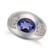 MAUBOUSSIN, AN IOLITE AND DIAMOND RING in 18ct white gold, set with a fancy cut iolite accented b...