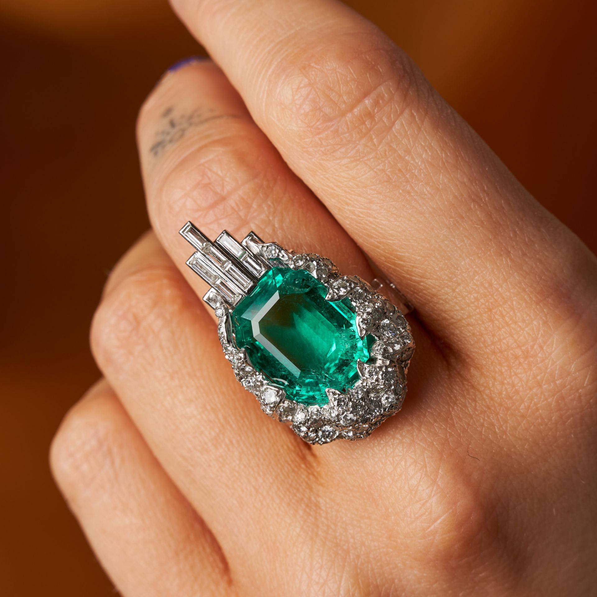 STERLE, AN IMPORTANT 9.89 CARAT UNTREATED COLOMBIAN EMERALD AND DIAMOND RING in platinum, set wit...