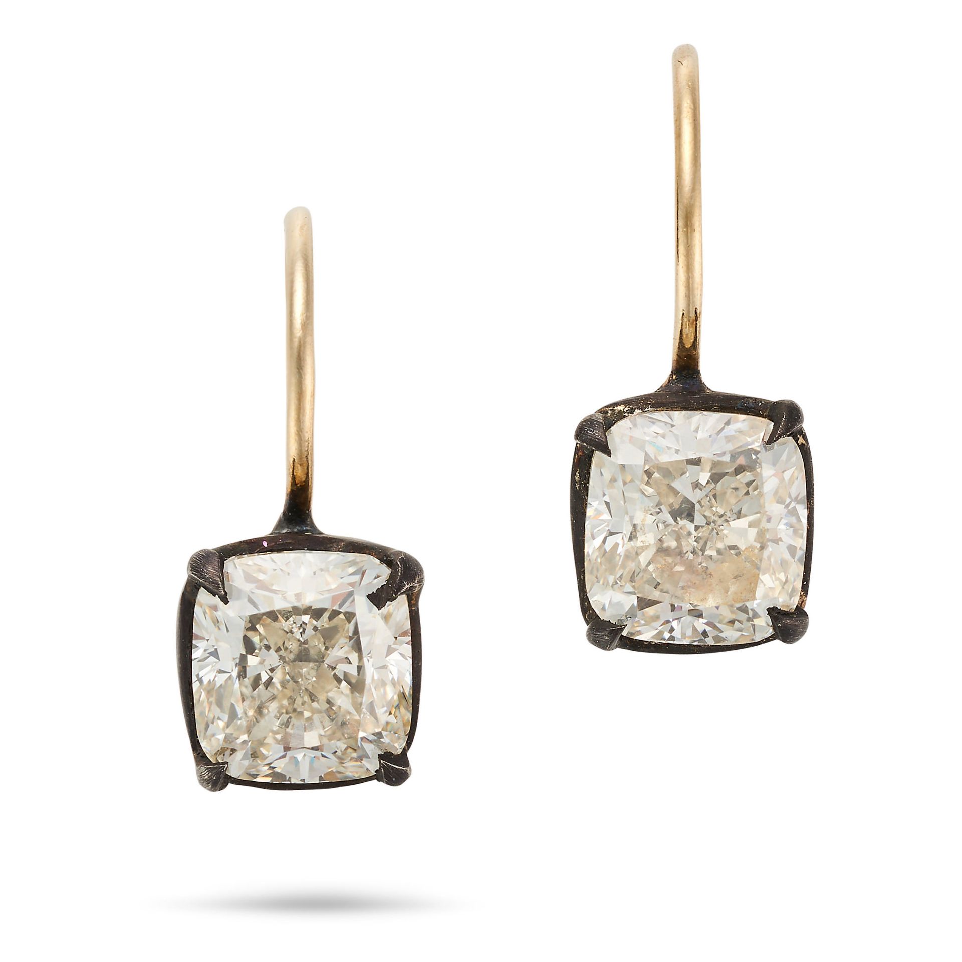 A PAIR OF DIAMOND EARRINGS each set with a cushion cut diamond, the diamonds both totalling 1.6-1...