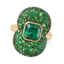 A GREEN TOURMALINE AND TSAVORITE GARNET COCKTAIL RING set with an octagonal step cut green tourma...