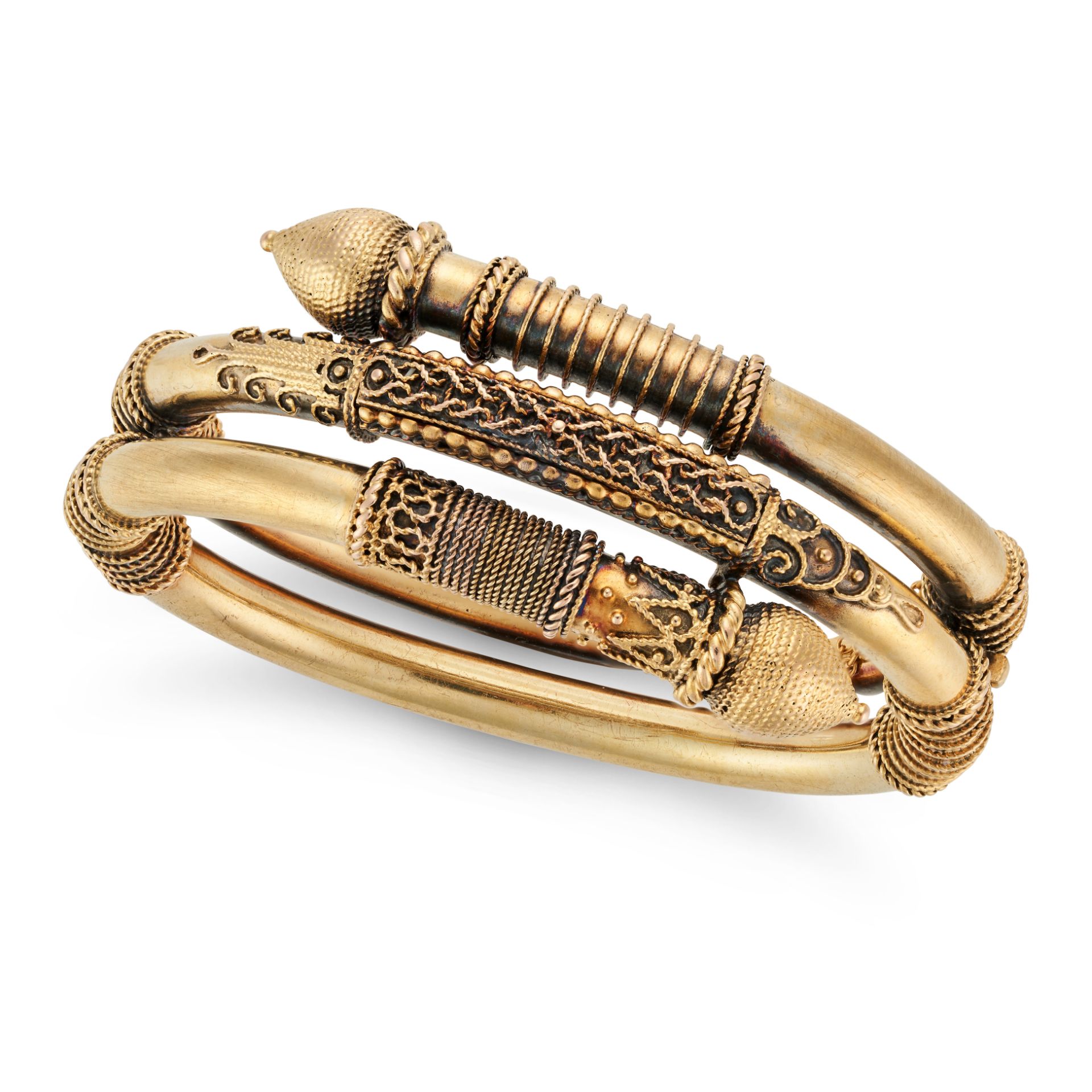 AN ANTIQUE ETRUSCAN REVIVAL BANGLE in 14ct yellow gold, the hinged bangle decorated with beaded a...