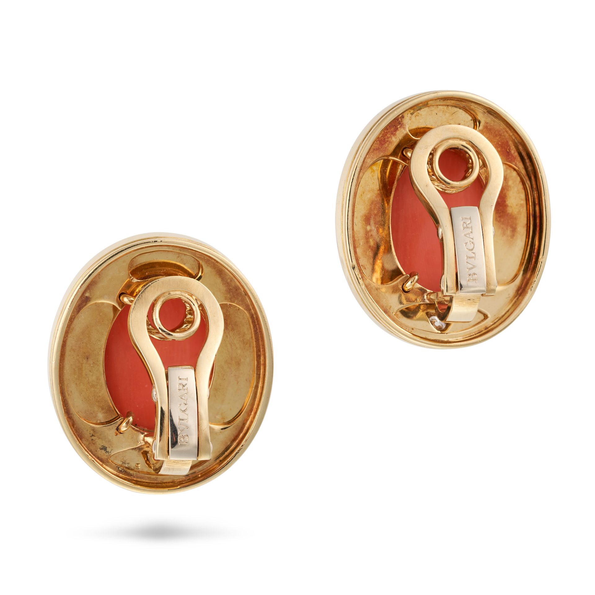 BULGARI, A PAIR OF CORAL, DIAMOND AND ENAMEL CLIP EARRINGS each set with an oval cabochon coral a... - Image 3 of 3