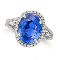 A FINE 7.12 CARAT CEYLON NO HEAT SAPPHIRE AND DIAMOND RING set with an oval cut sapphire of 7.12 ...