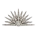 AN ANTIQUE DIAMOND SUNBURST BROOCH in yellow gold and silver, designed as a thirteen rayed rising...