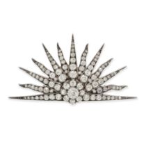 AN ANTIQUE DIAMOND SUNBURST BROOCH in yellow gold and silver, designed as a thirteen rayed rising...