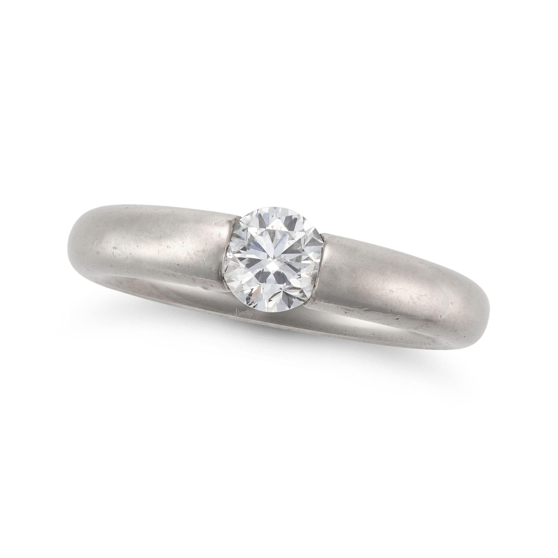 NIESSING, A DIAMOND SPANNRING RING tension set with a round brilliant cut diamond of approximatel...