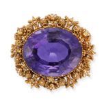 AN ANTIQUE AMETHYST BROOCH set with an oval cut amethyst in a filigree style border, no assay mar...