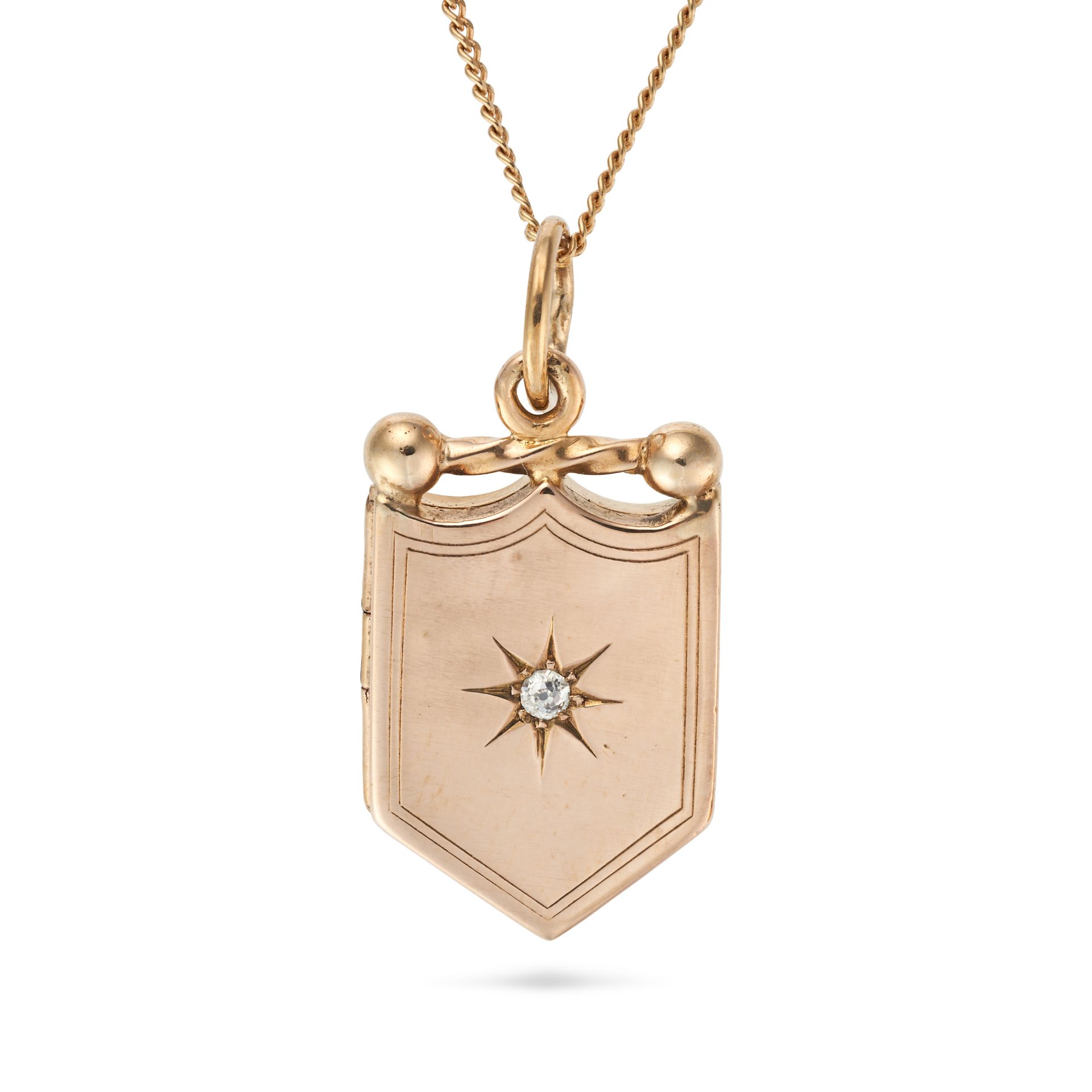 AN ANTIQUE DIAMOND LOCKET PENDANT NECKLACE in yellow gold, the shield shaped pendant set with an ...