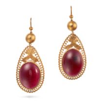 A PAIR OF ANTIQUE GARNET DROP EARRINGS in yellow gold, each suspending a carbuncle cabochon garne...