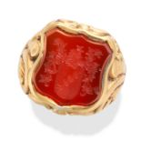 AN ANTIQUE CARNELIAN INTAGLIO SIGNET RING set with a shield shaped carnelian intaglio carved to d...