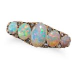 AN ANTIQUE OPAL FIVE STONE RING in yellow gold, set with five oval cabochon opals accented by ros...