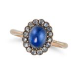 A SAPPHIRE AND DIAMOND CLUSTER RING set with an oval cabochon sapphire in a cluster of rose cut d...