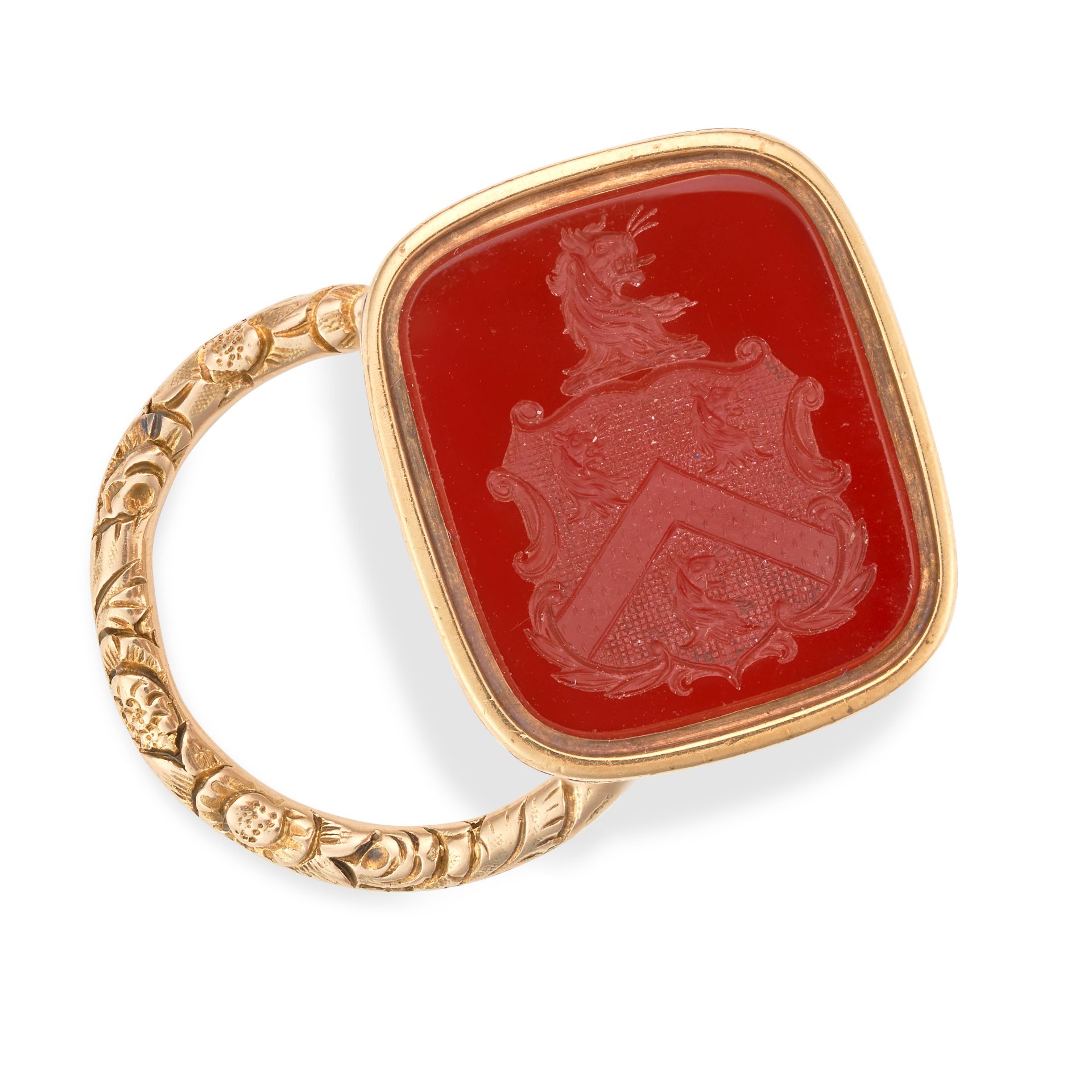 AN ANTIQUE CARNELIAN FOB SEAL / PENDANT set with a carnelian intaglio carved to depict a coat of ...