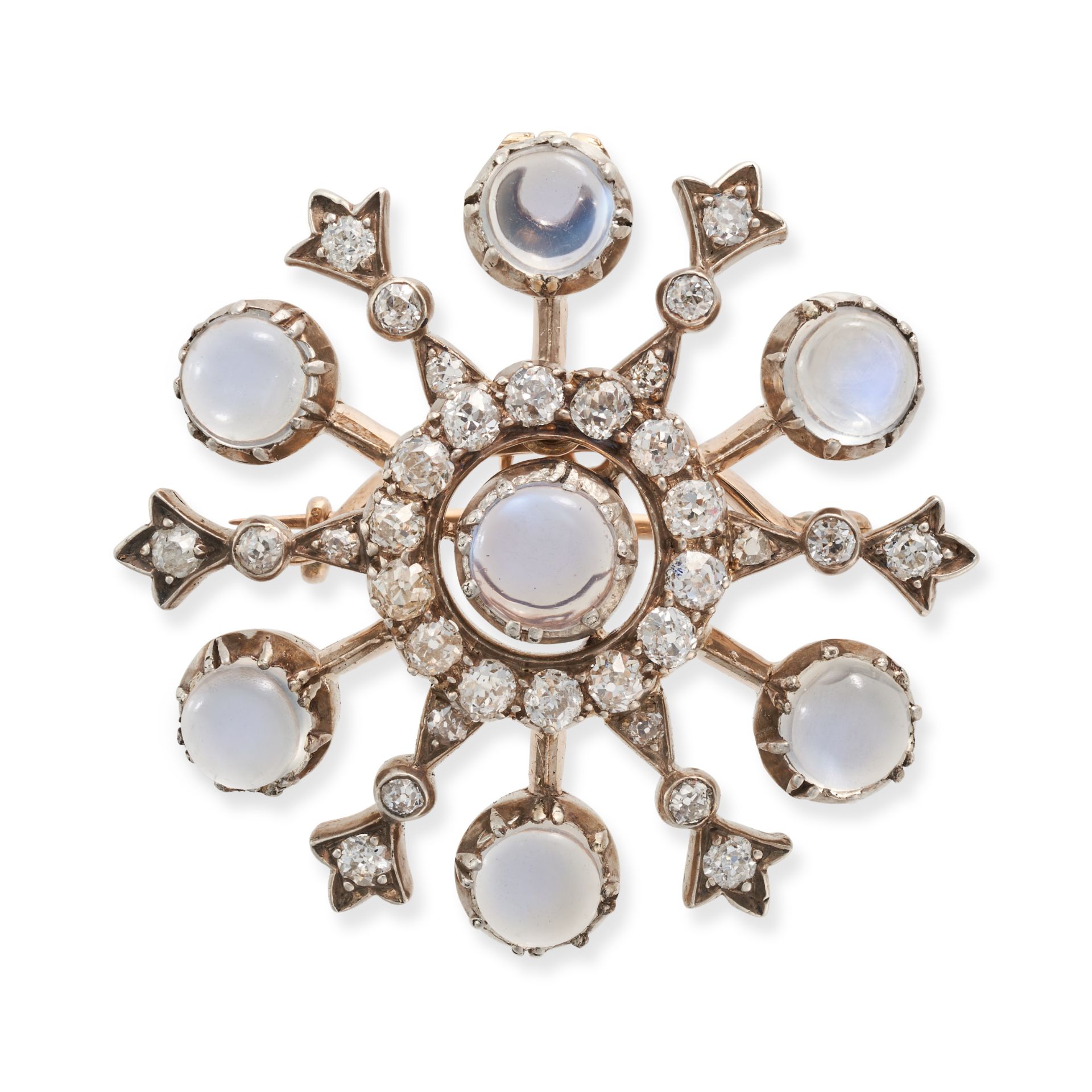 AN ANTIQUE MOONSTONE AND DIAMOND SNOWFLAKE BROOCH / PENDANT in yellow gold and silver, designed a...