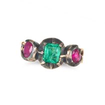 AN ANTIQUE EMERALD AND RUBY RING in yellow gold and silver, set with an octagonal step cut emeral...