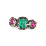 AN ANTIQUE EMERALD AND RUBY RING in yellow gold and silver, set with an octagonal step cut emeral...