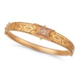 A DIAMOND BANGLE in 9ct yellow gold, the hinged bangle set with three round cut diamonds in a clo...