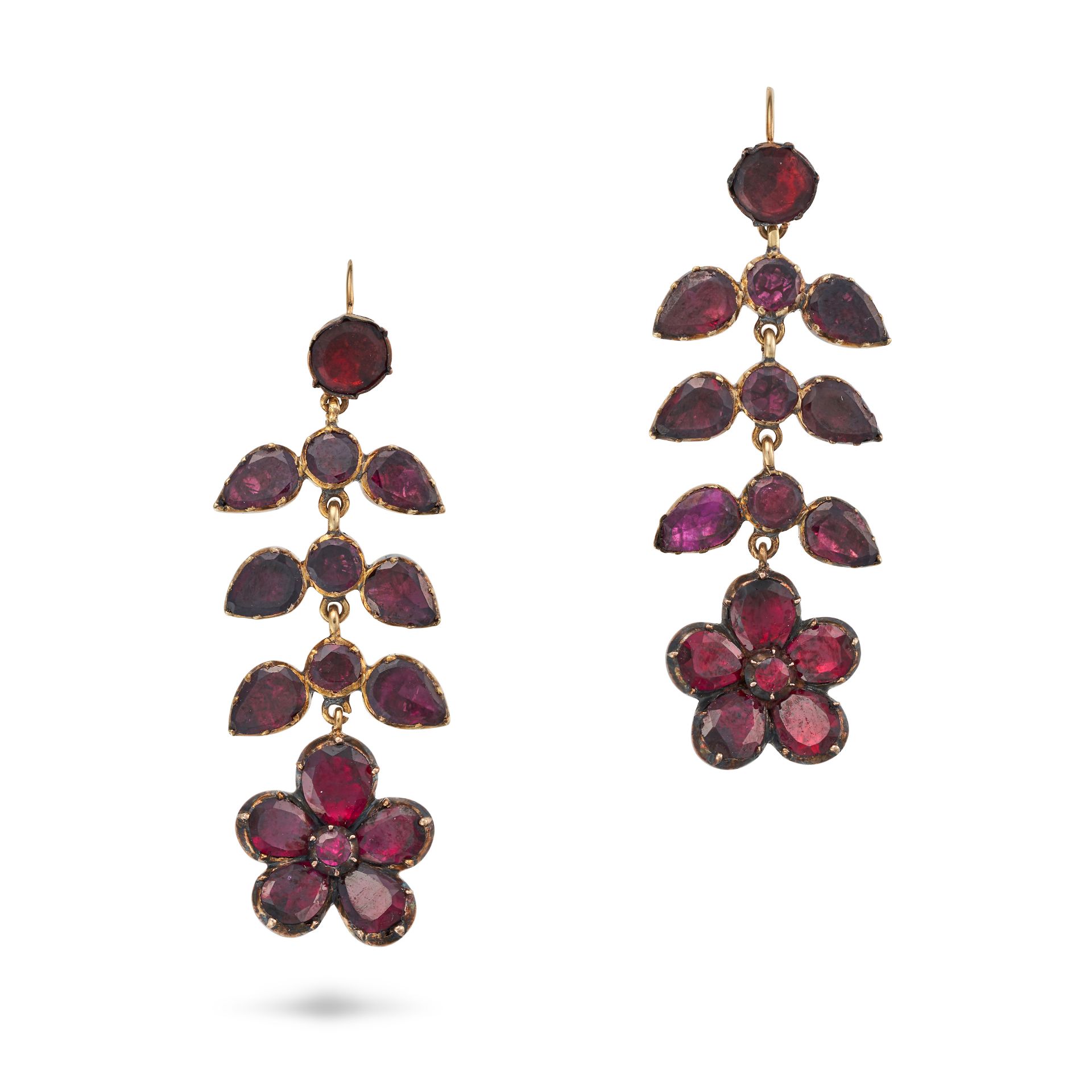 A PAIR OF GARNET DROP EARRINGS each comprising a row of round cut garnets accented by pear cut ga...