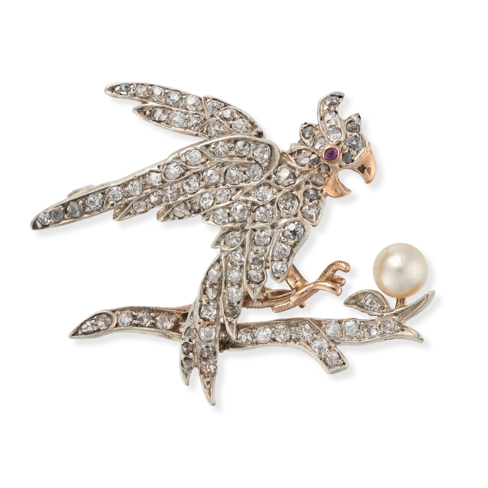 A DIAMOND, PEARL AND RUBY BIRD BROOCH designed as a bird on a branch with a pearl egg, the bird a...