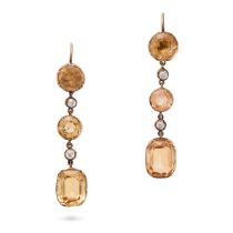 A PAIR OF TOPAZ AND DIAMOND DROP EARRINGS each comprising a row of alternating round and cushion ...