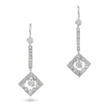 A PAIR OF DIAMOND DROP EARRINGS each set with a round brilliant cut diamond suspending a row of r...