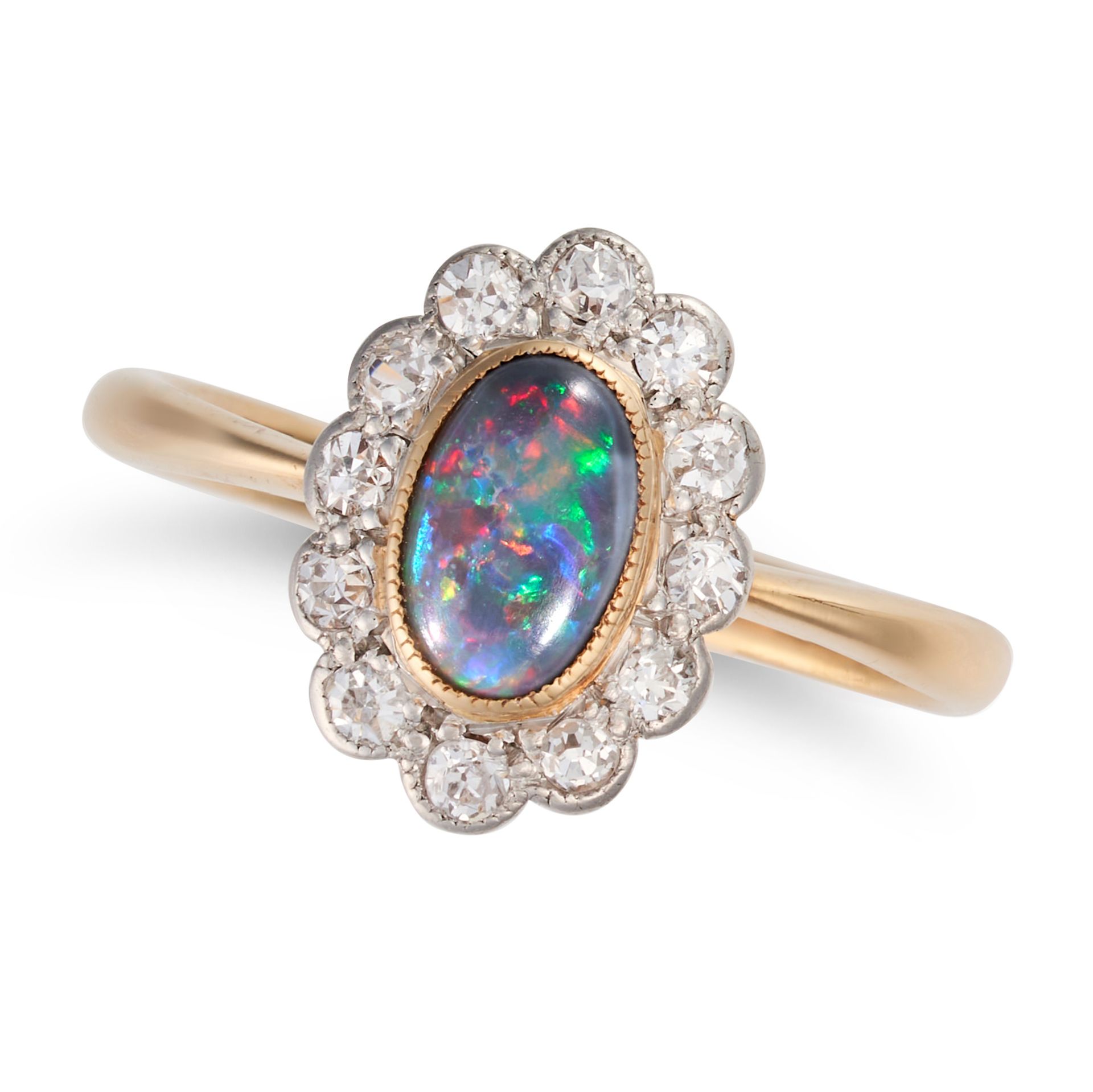 AN OPAL AND DIAMOND CLUSTER RING set with an oval cabochon opal in a cluster of round cut diamond...
