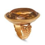 A LARGE ANTIQUE CITRINE INTAGLIO RING in 18ct yellow gold, set with an oval mixed cut citrine car...