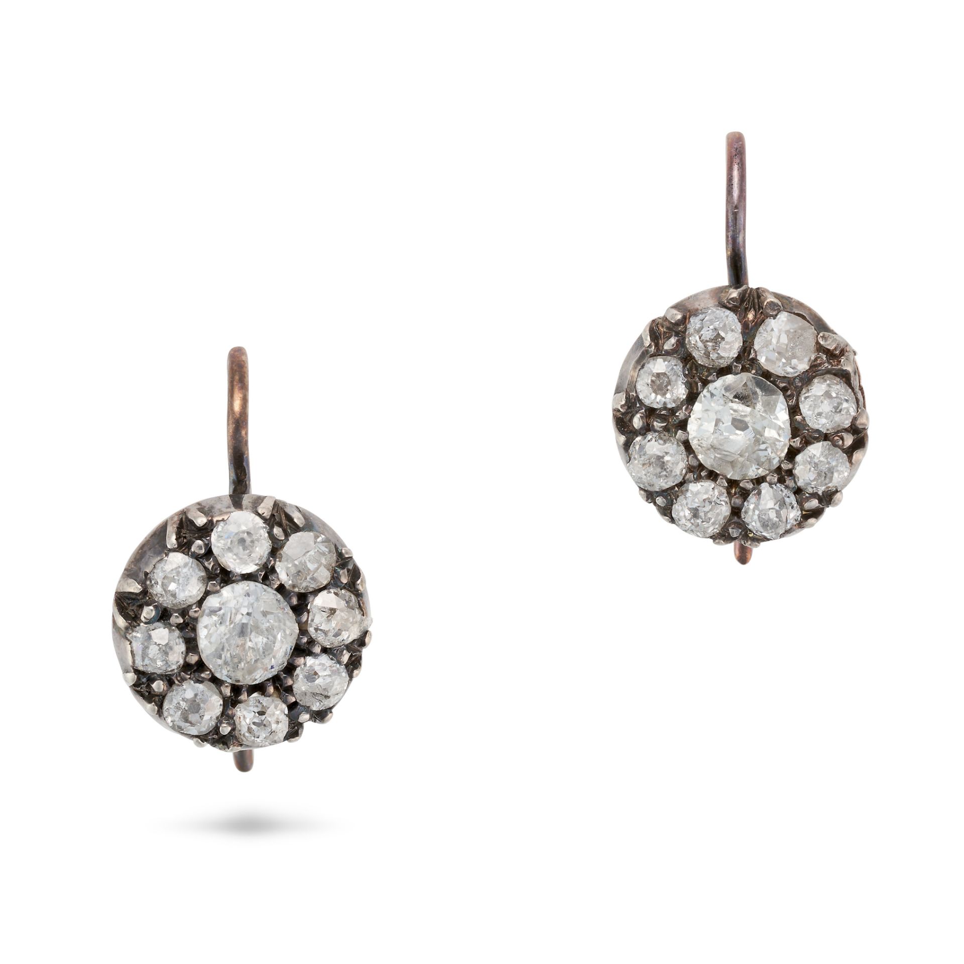 A PAIR OF ANTIQUE DIAMOND CLUSTER EARRINGS in yellow gold and silver, each set with an old cut di...