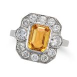 A YELLOW SAPPHIRE AND DIAMOND RING set with an octagonal step cut yellow sapphire of approximatel...