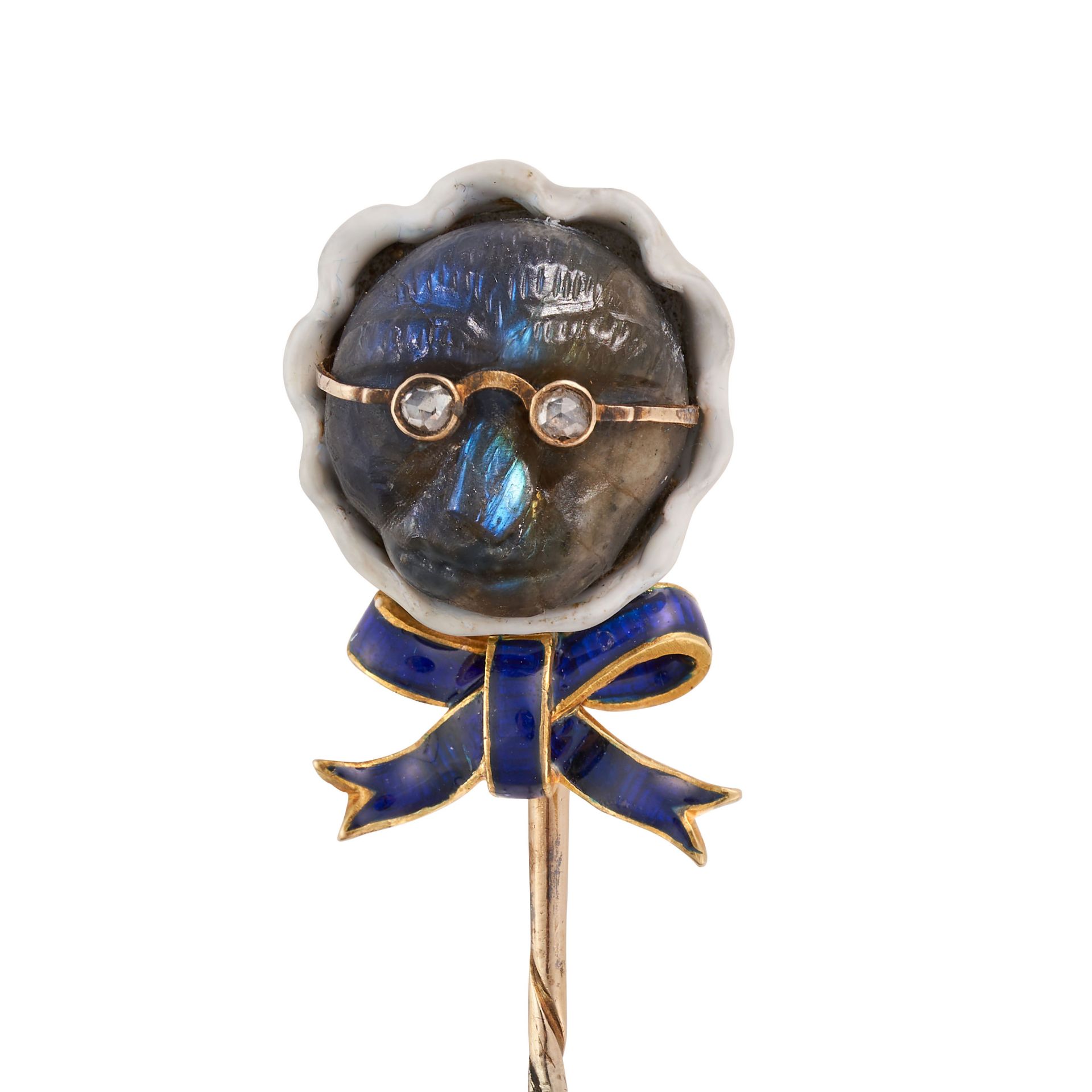 A LABRADORITE, DIAMOND AND ENAMEL MONKEY NOVELTY STICK PIN designed as a monkey in spectacles wea...